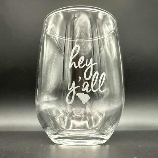 Clear glass tumbler with 'hey y'all' text and a map of South Carolina