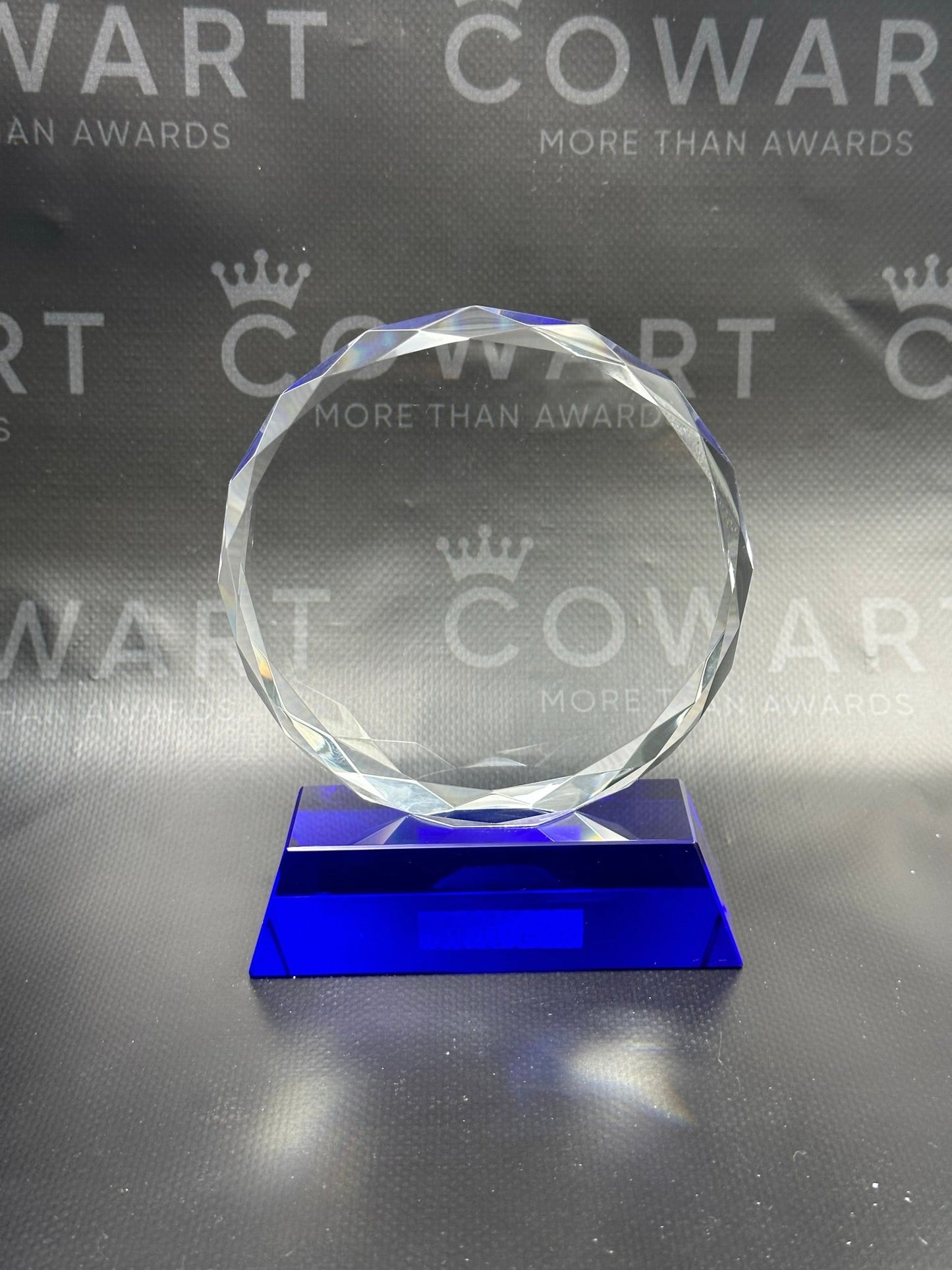 Round Facet Crystal on Blue Pedestal Base