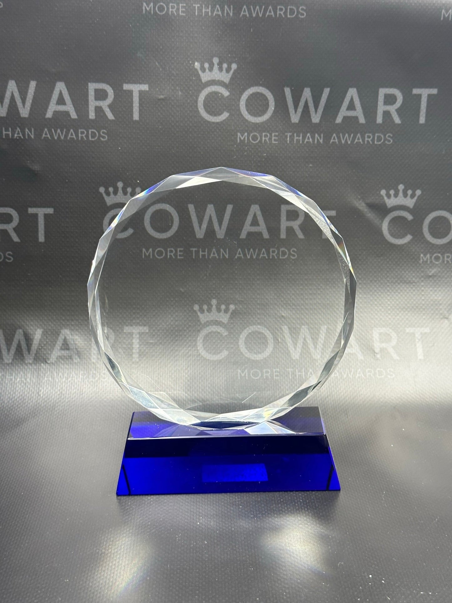 Round Facet Crystal on Blue Pedestal Base