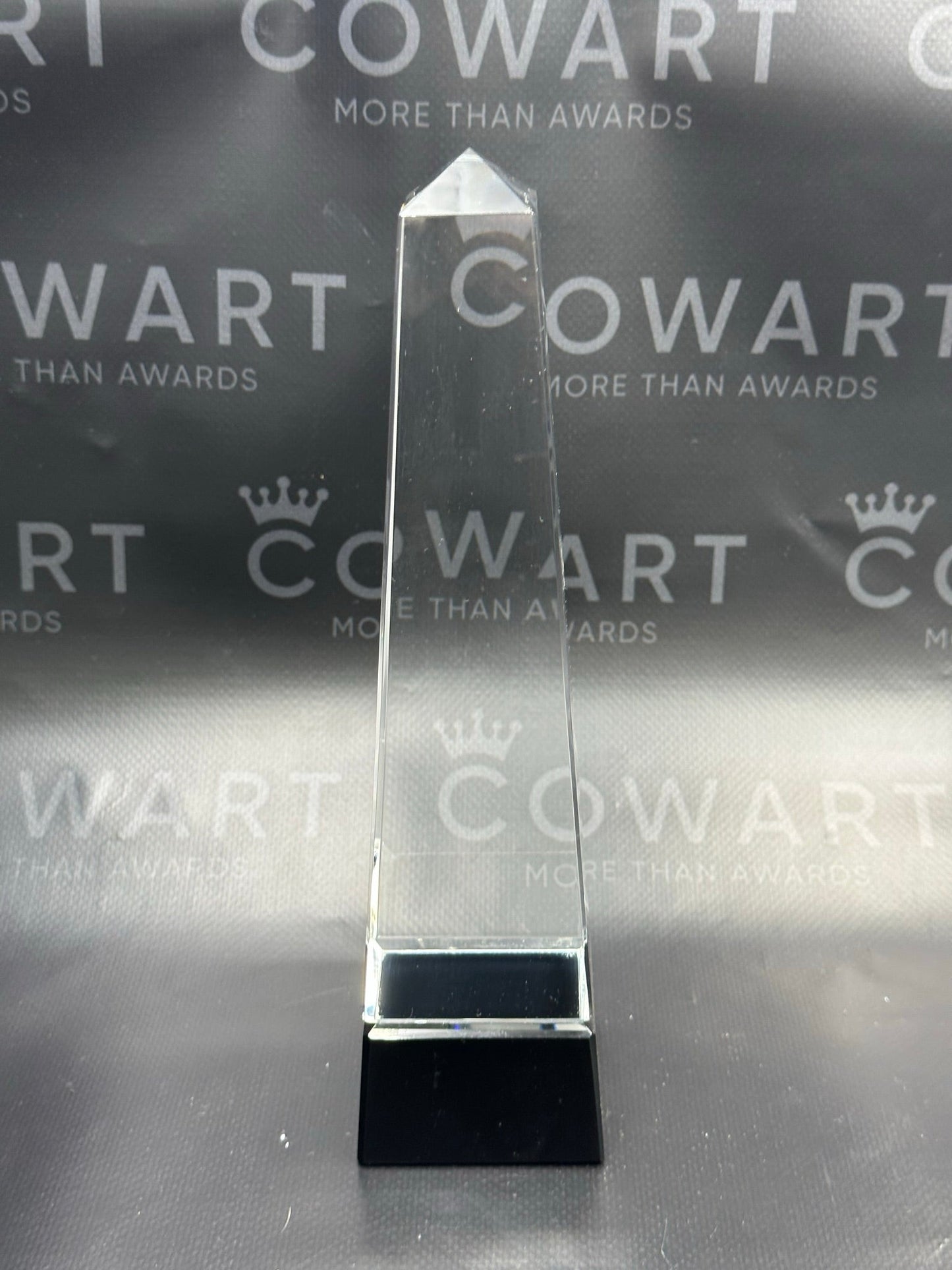 Obelisk Crystal on Black Pedestal Base