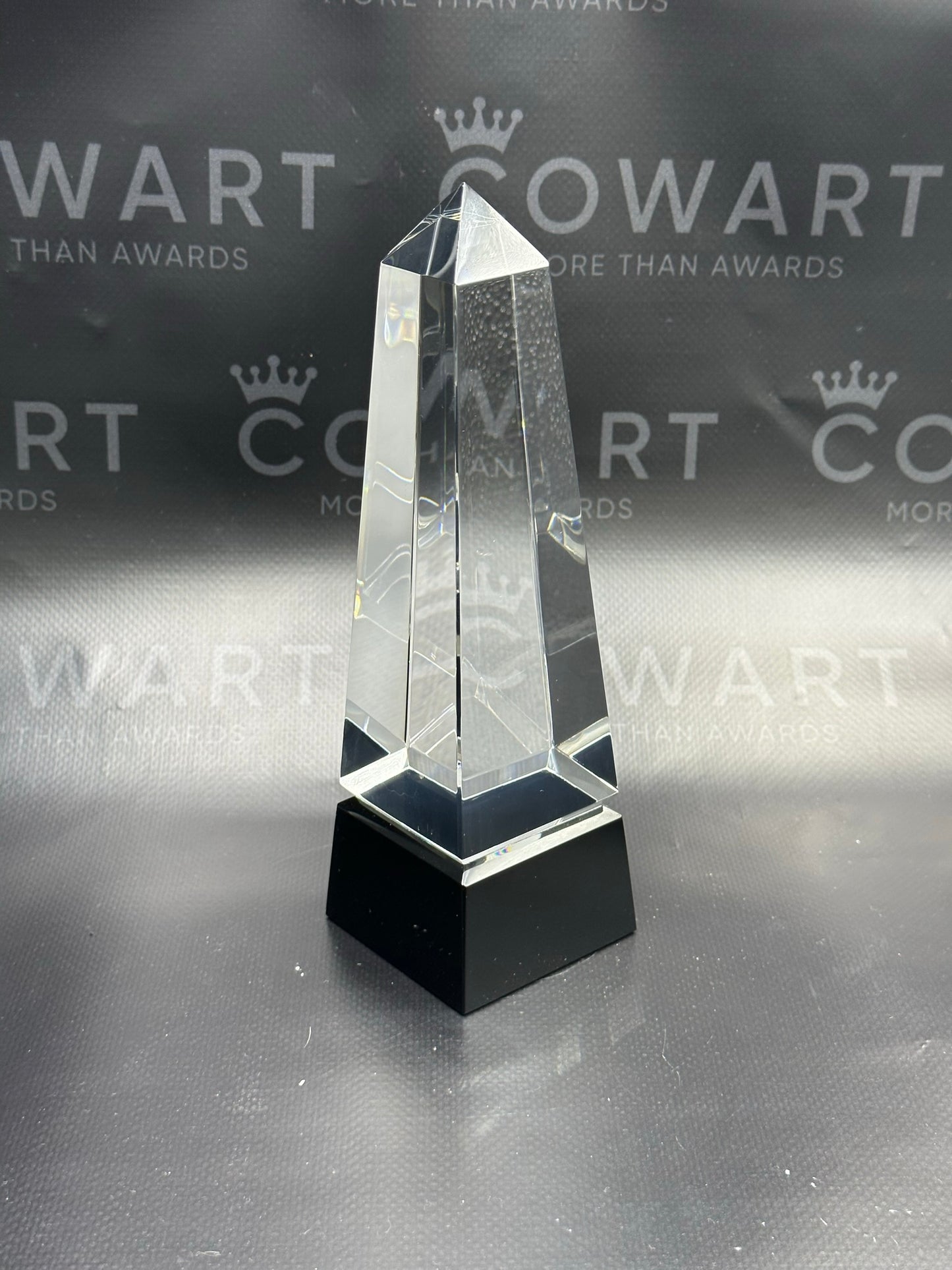 Obelisk Crystal on Black Pedestal Base