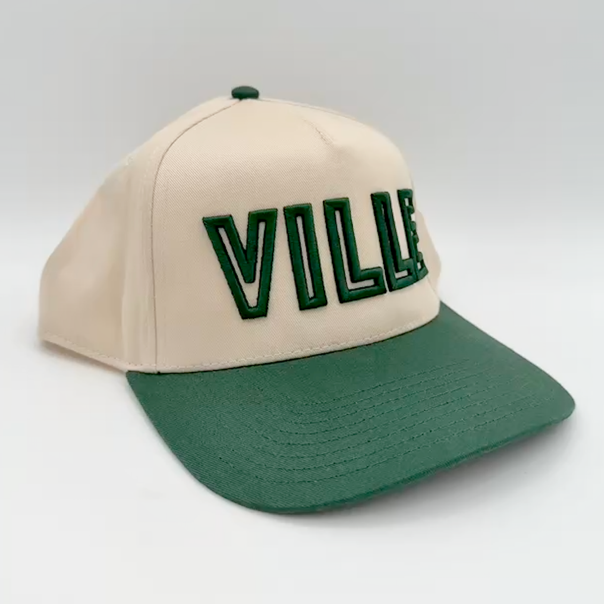 Beige and green cap with stitched 'VILLE' text