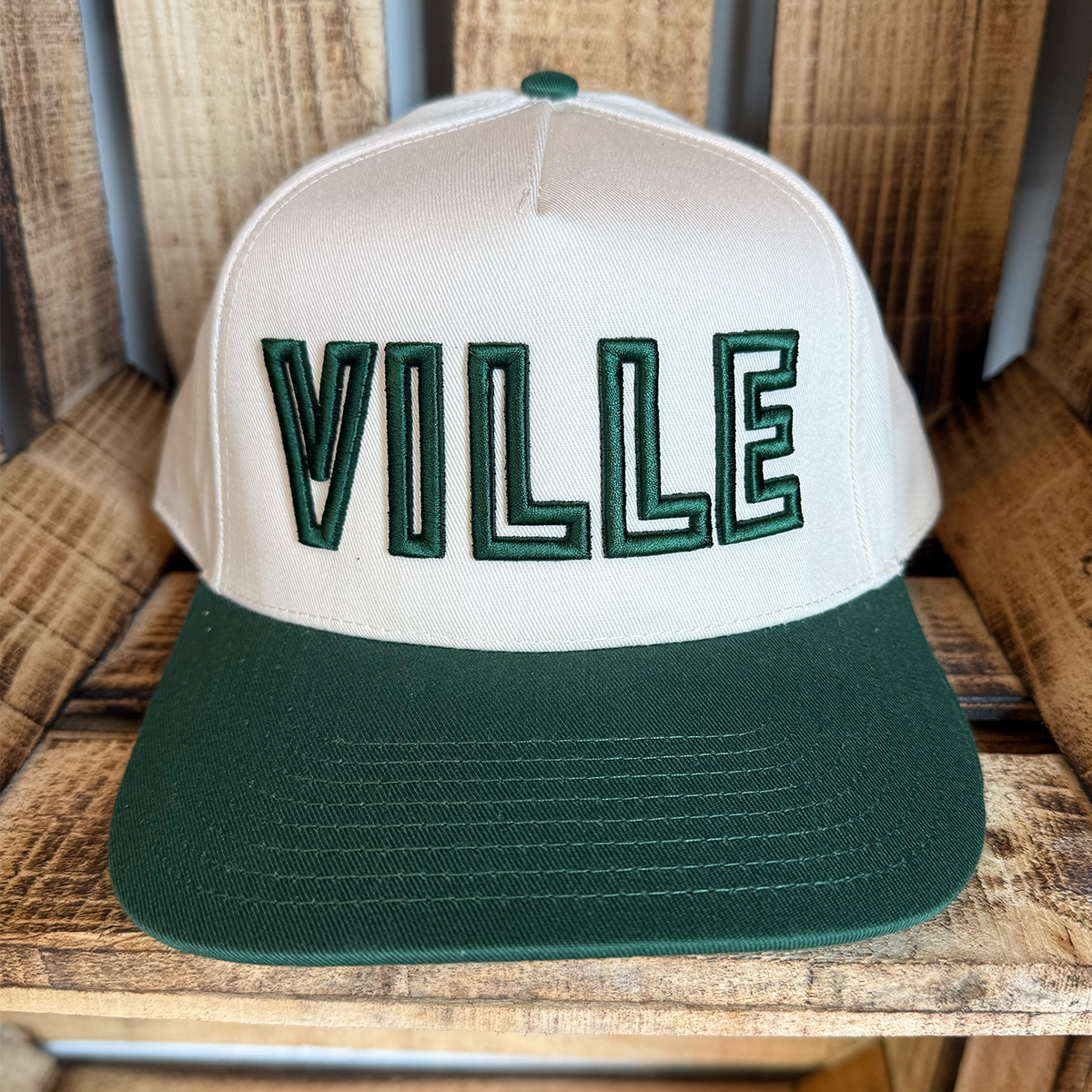 Beige and green cap with stitched 'VILLE' text