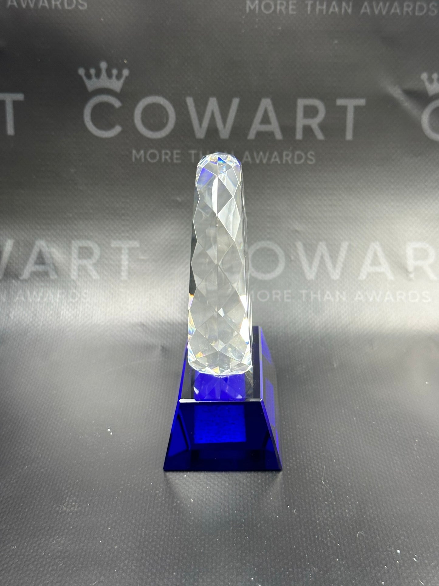 Round Facet Crystal on Blue Pedestal Base
